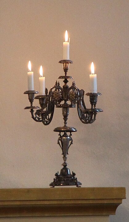 A candelabra, with lit candles.