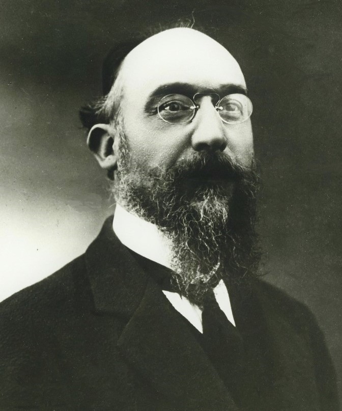 Erik Satie wearing pince-nez.